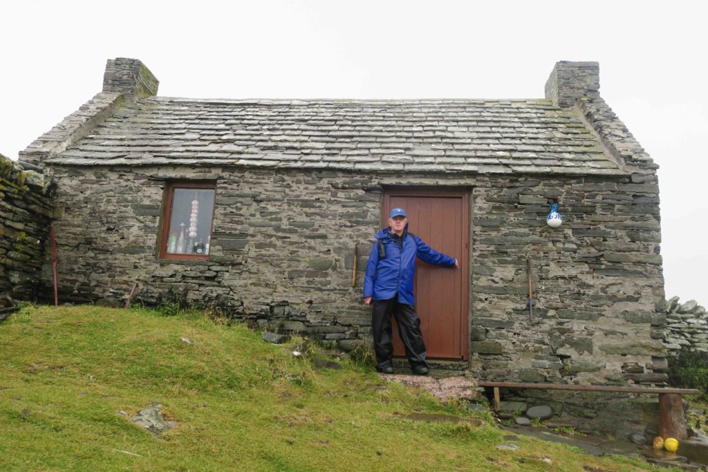 Pete outside the bothy on Mousa where he lived during his doctoral field work